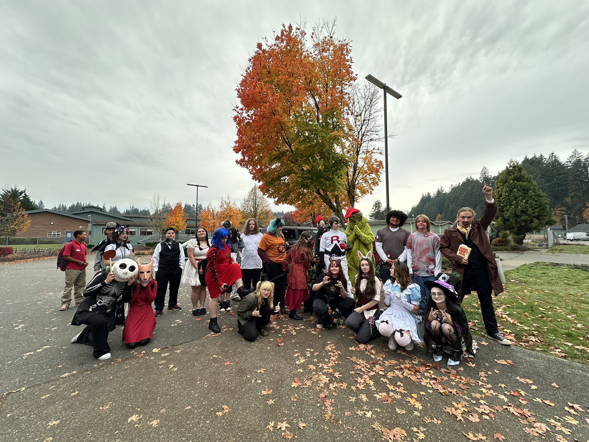 Cedar students gathered outside in costume on a fall day
