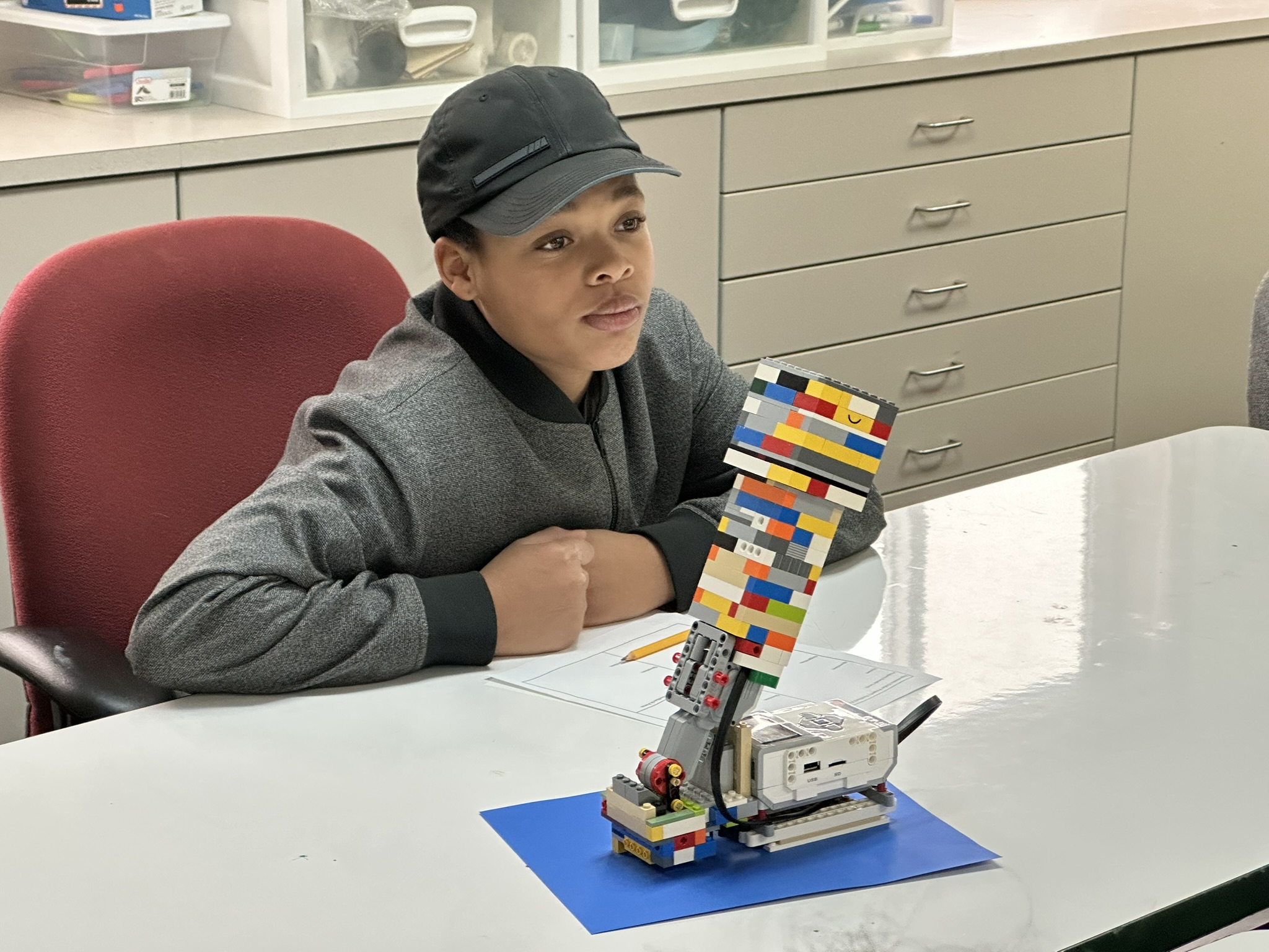 A Cedar student presenting a LEGO robotics project in class